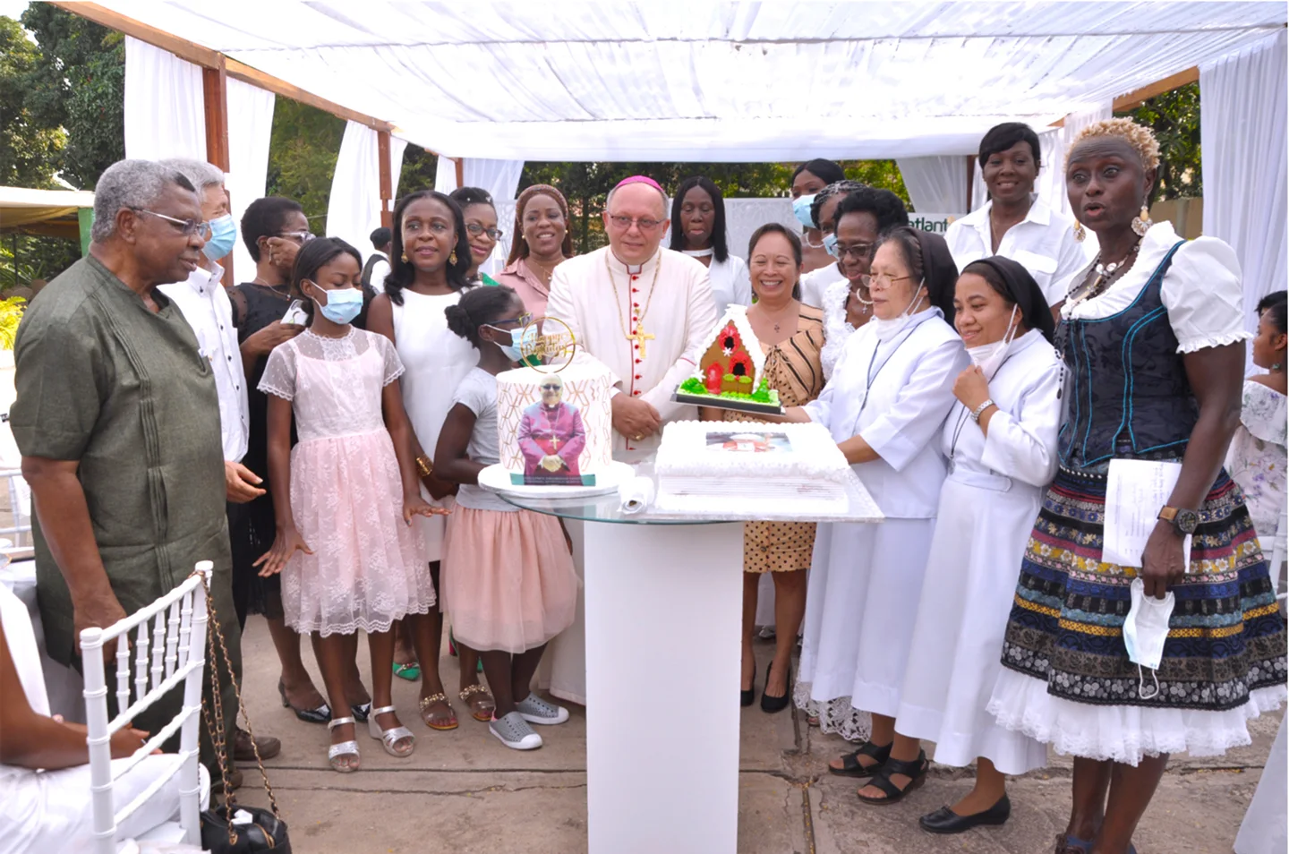 Guests gathered around the MGC anniversary cake