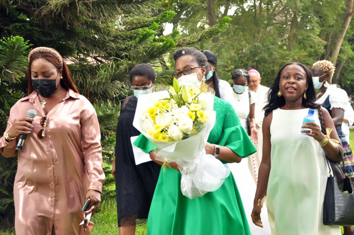 Guests sharing flowers during the anniversary gathering