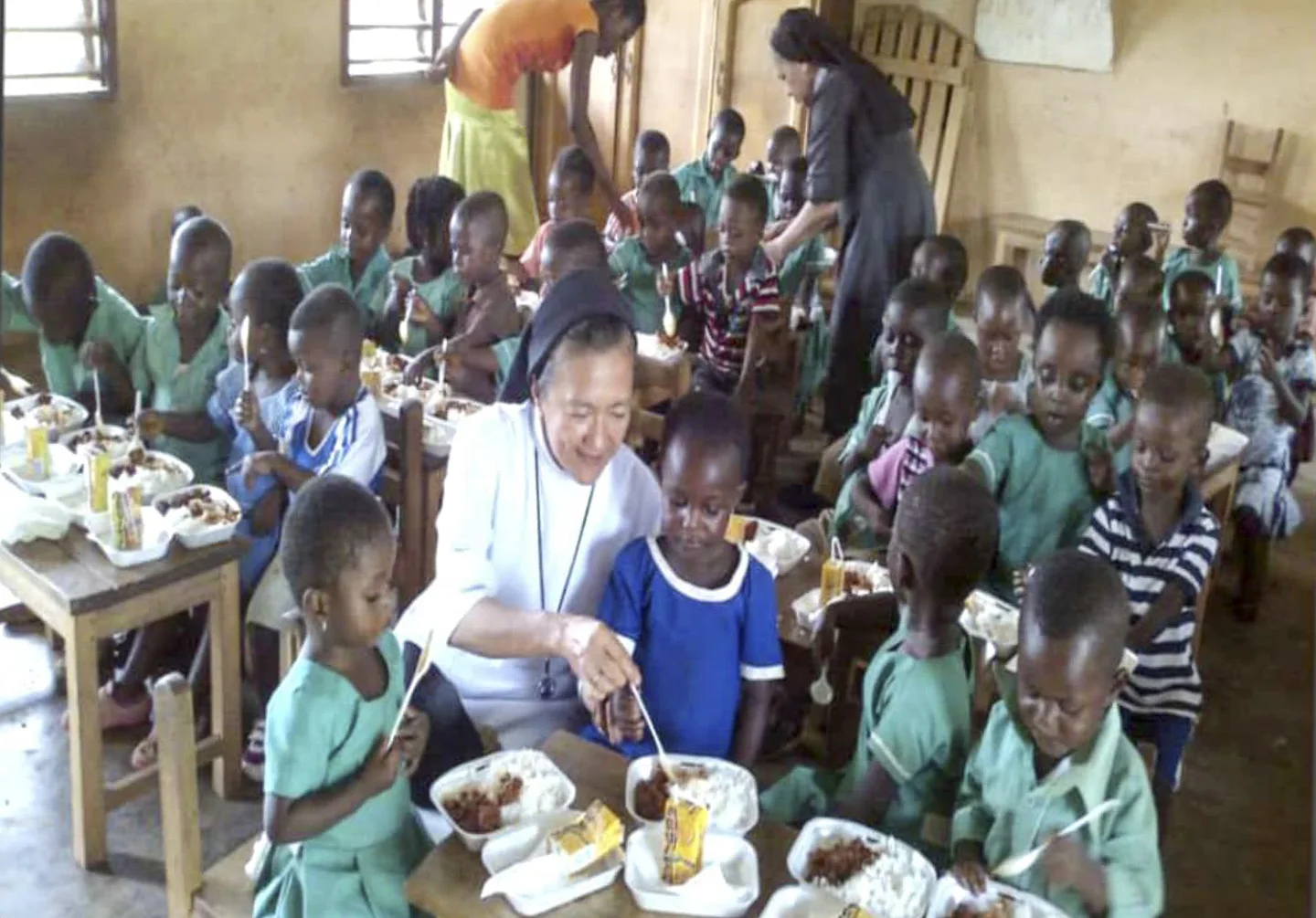 An RVM sister working with children in a classroom