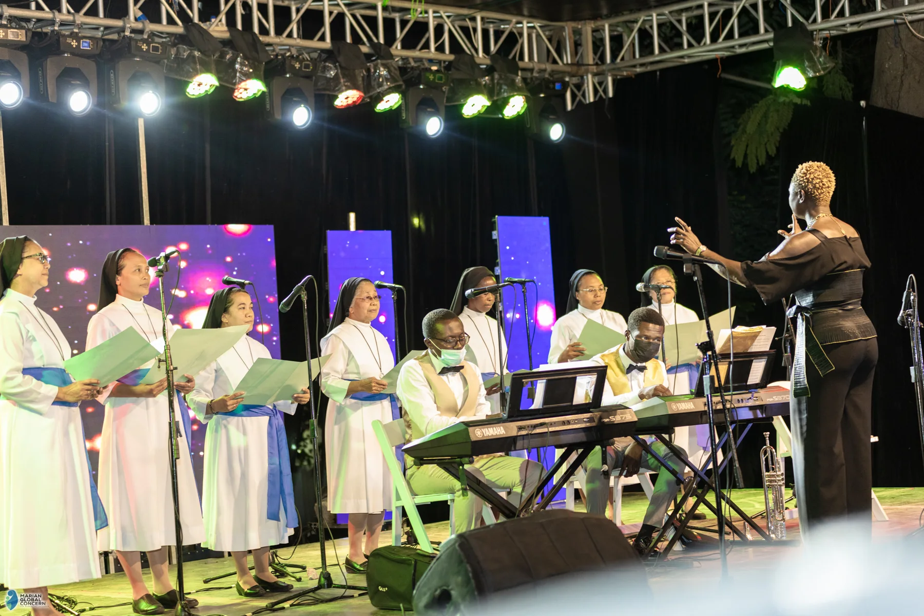 Grace Chorale International performing at the MGCWC fundraiser